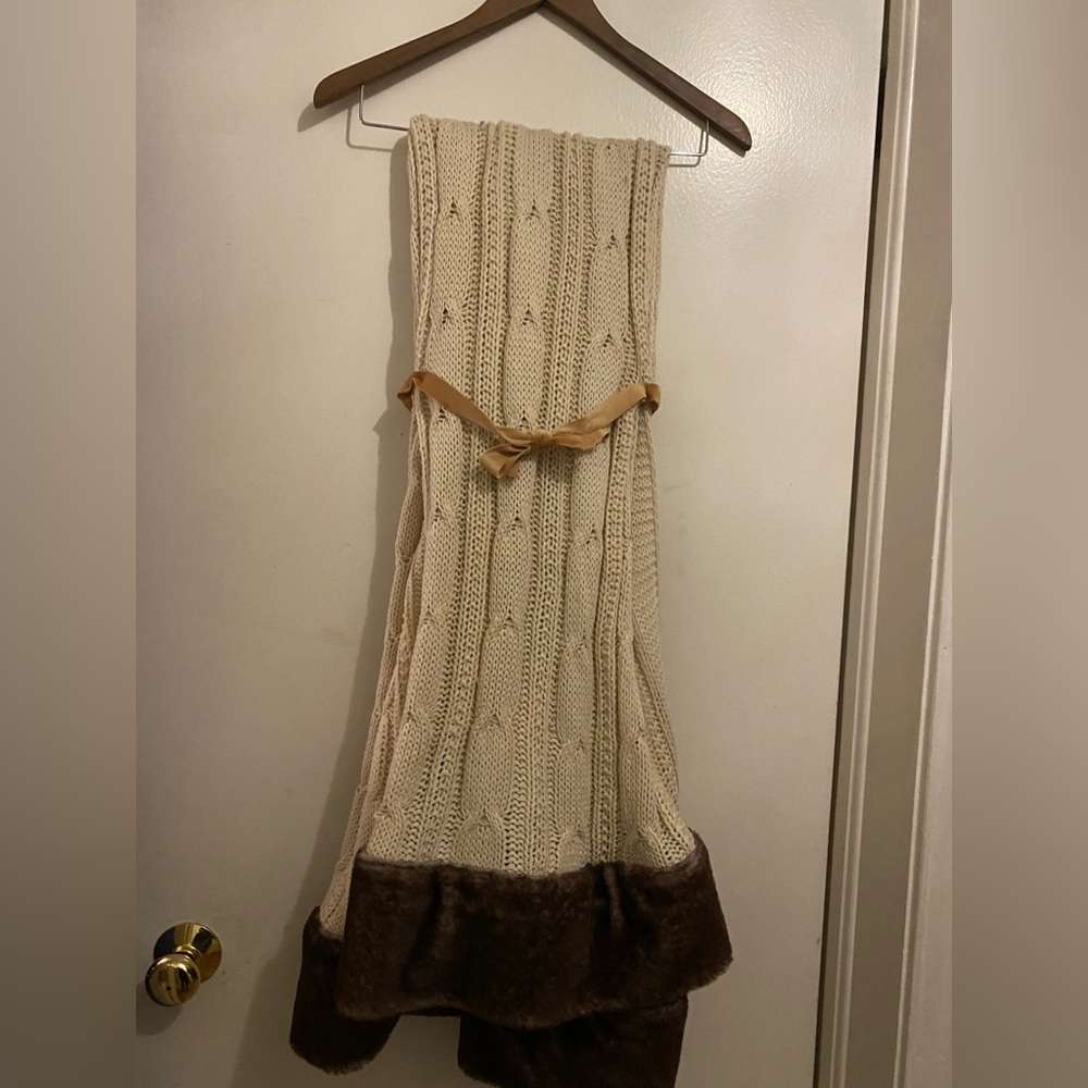 Cream colored cable knit throw